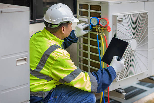 Professional Heat Pump Repair technician working in Loretto, TN